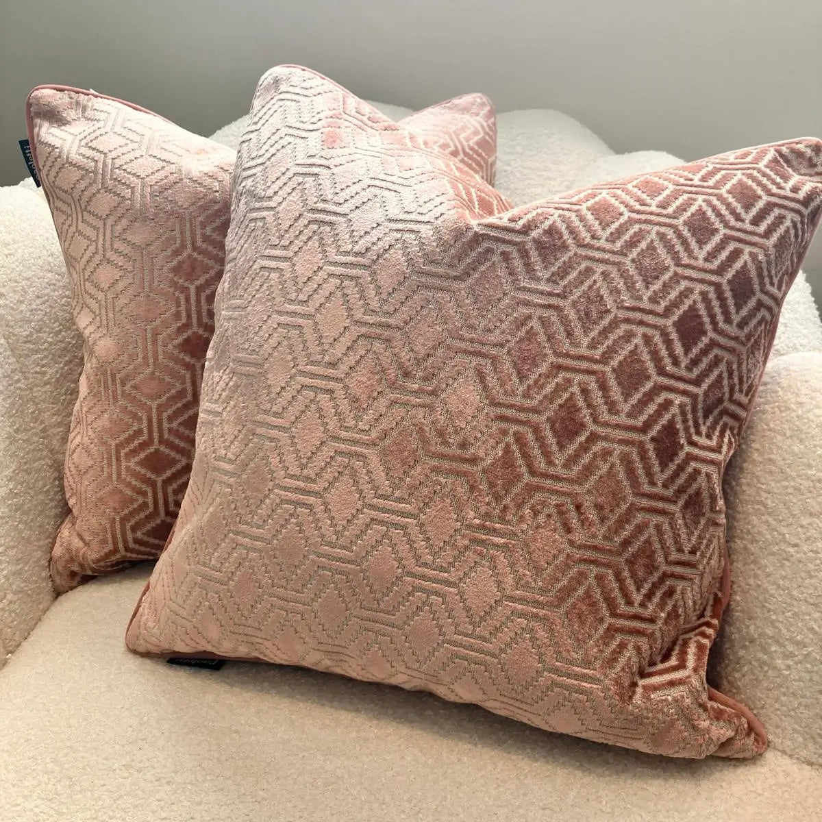Pink plush velvet Wellington patterned square cushions, with matching pink piping and reverse. Complete with feather filled insert, available to purchase from Albury House Interiors, Essex. 