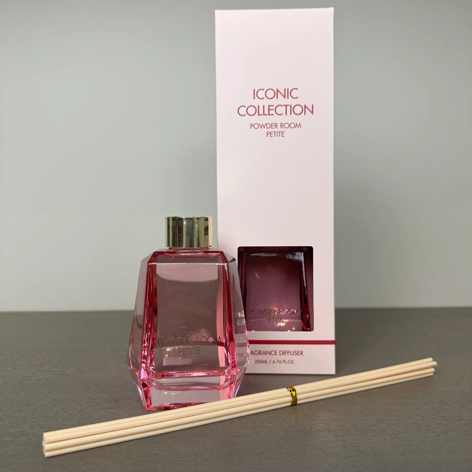 pink-glass-powder-room-reed-diffuser-with-rose-and-oud-scent-comes-gift-boxes-with-wooden-reeds-from-albury-house-interiors