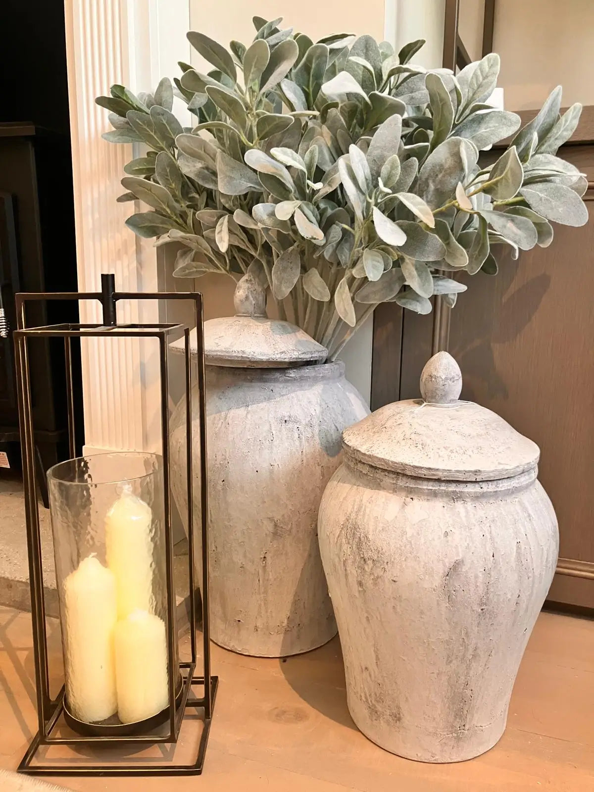 raphael-iron-frame-brushed-brass-finish-single-glass-hurricane-lamp-with-stone-grey-ginger-jars-small-and-large-at-albury-house-interiors
