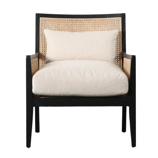 Rattan armchair with black wooden frame and natural coloured rattan, includes a neutral seat cushion and back cushion. Available at Albury House Interiors Essex.