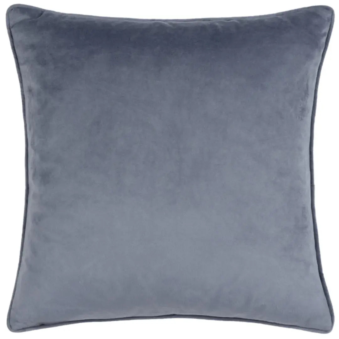 Square navy velvet cushion with bubble effect pattern on front face and plain soft velvet on the reverse side, with matching piped edges. Available at Albury House Interiors, home decor store in Essex.