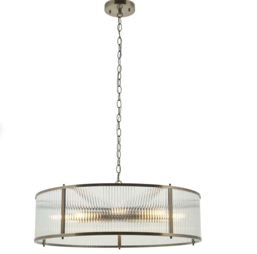 Ribbed glass, brass finish circular Chandelier light with metallic finish and clear glass shade on a white background