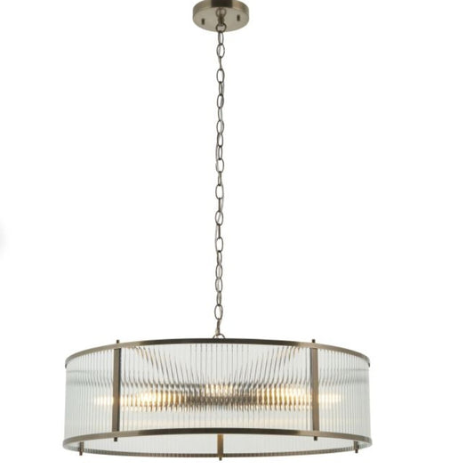 Ribbed glass, brass finish circular Chandelier light with metallic finish and clear glass shade on a white background