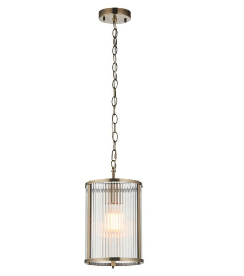 Pendant brass metal light with ribbed glass shade hung on a chain, on a white background