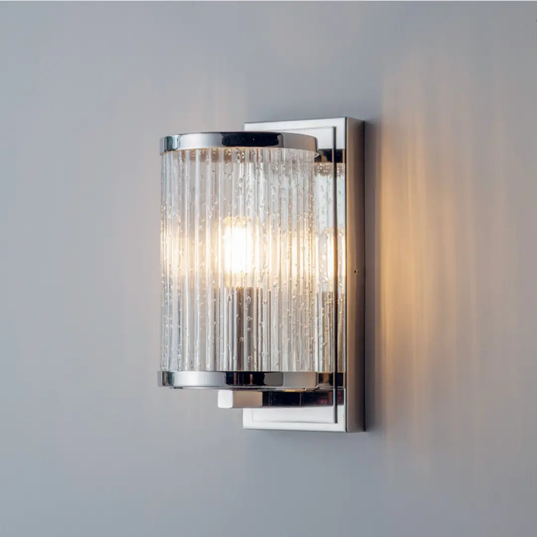 Bright nickel plated wall light, featuring  ribbed glass with a bubble effect throughout - creating a beautiful diffused light. Available to purchase from Albury House Interiors, homewares in the UK.