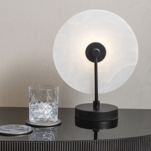 White marble quartz disc table lamp with black base and accents at Albury House Interiors Essex