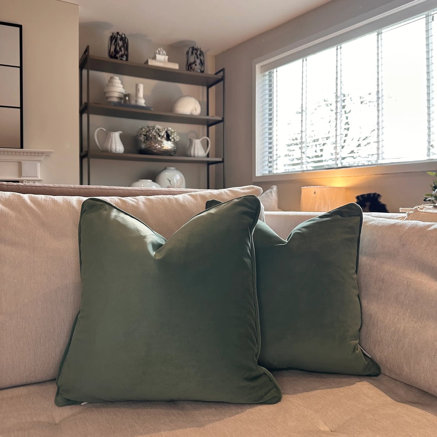 sage-green-velvet-square-shaped-cushion-wth-piped-edges-and-feather-insertson-beige-bespoke-sofa-at-albury-house-interiors-home-decor-shop-essex
