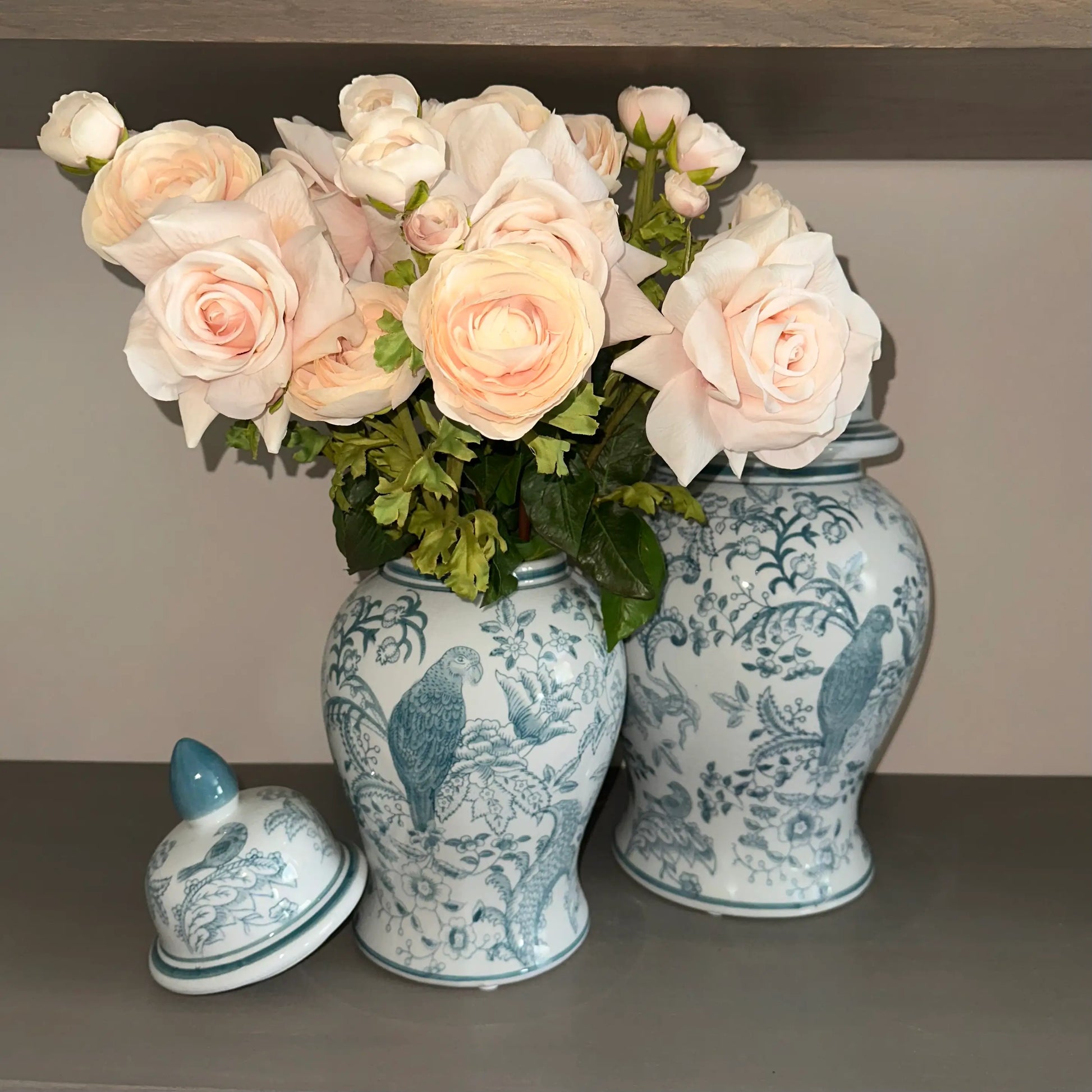 Senegal decorative lidded ginger jars in white and turquoise blue, with floral patterns and birds. Available to purchase from Albury House Interiors, home decor in Essex, UK. 