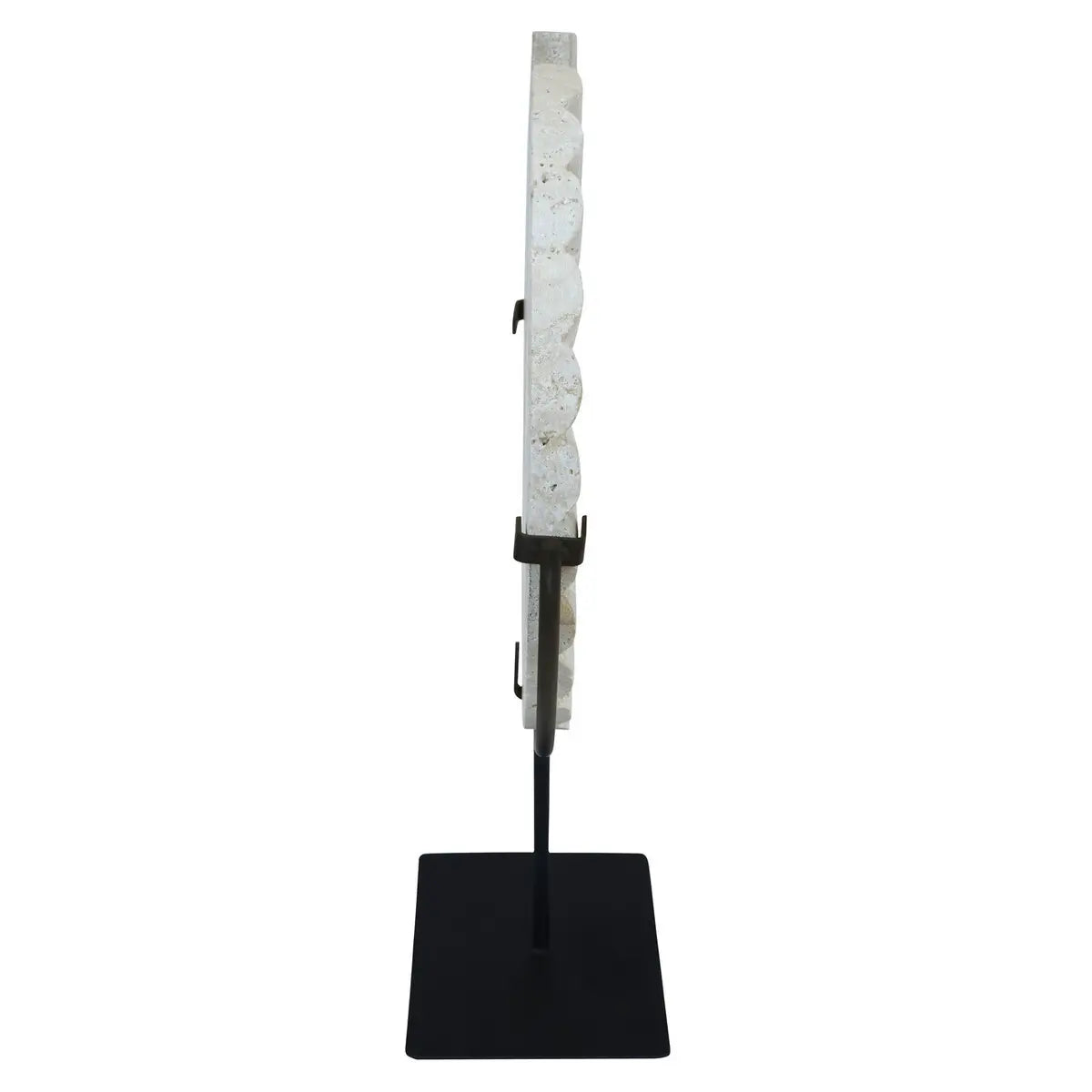 sideview-of-natural-travertine-stone-disc-sculpture-placed-on-matt-black-stand-at-albury-house-interiors