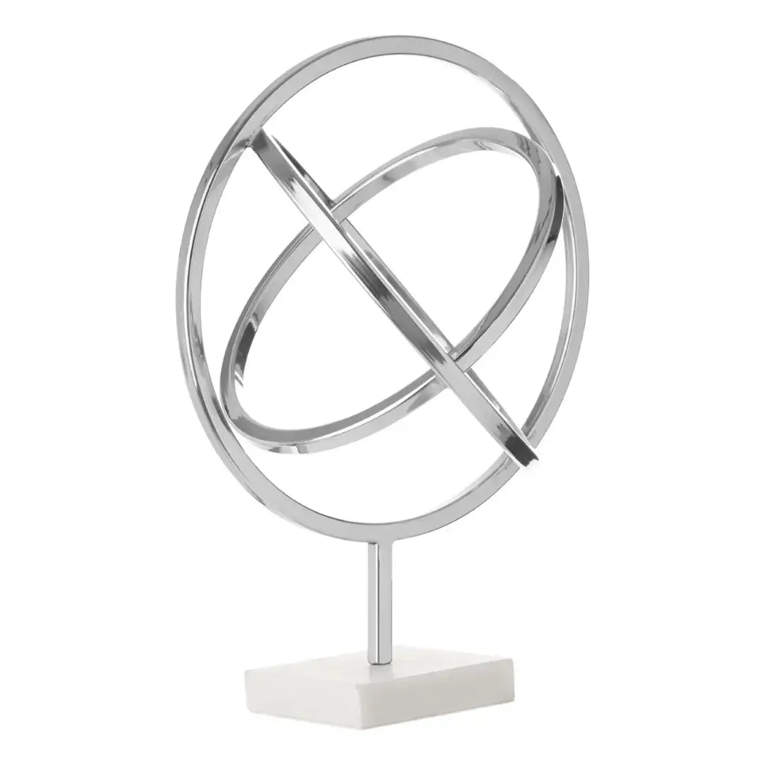 chrome-siver-spiral-round-sculpture-on-marble-base-at-albury-house-interiors