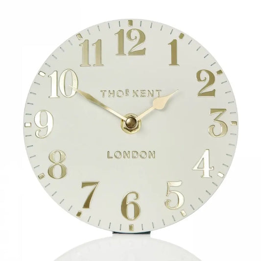 small-round-decorative-mantel-clock-with-cream-face-and-gold-numbers-and-hands-at-albury-house-interiors-essex