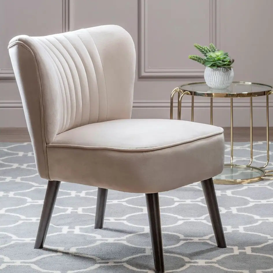 Sorrento plush cream velvet occasional chair with pleated detailing on backrest, matching cream piped edges and black wooden legs, at Albury House Interiors 