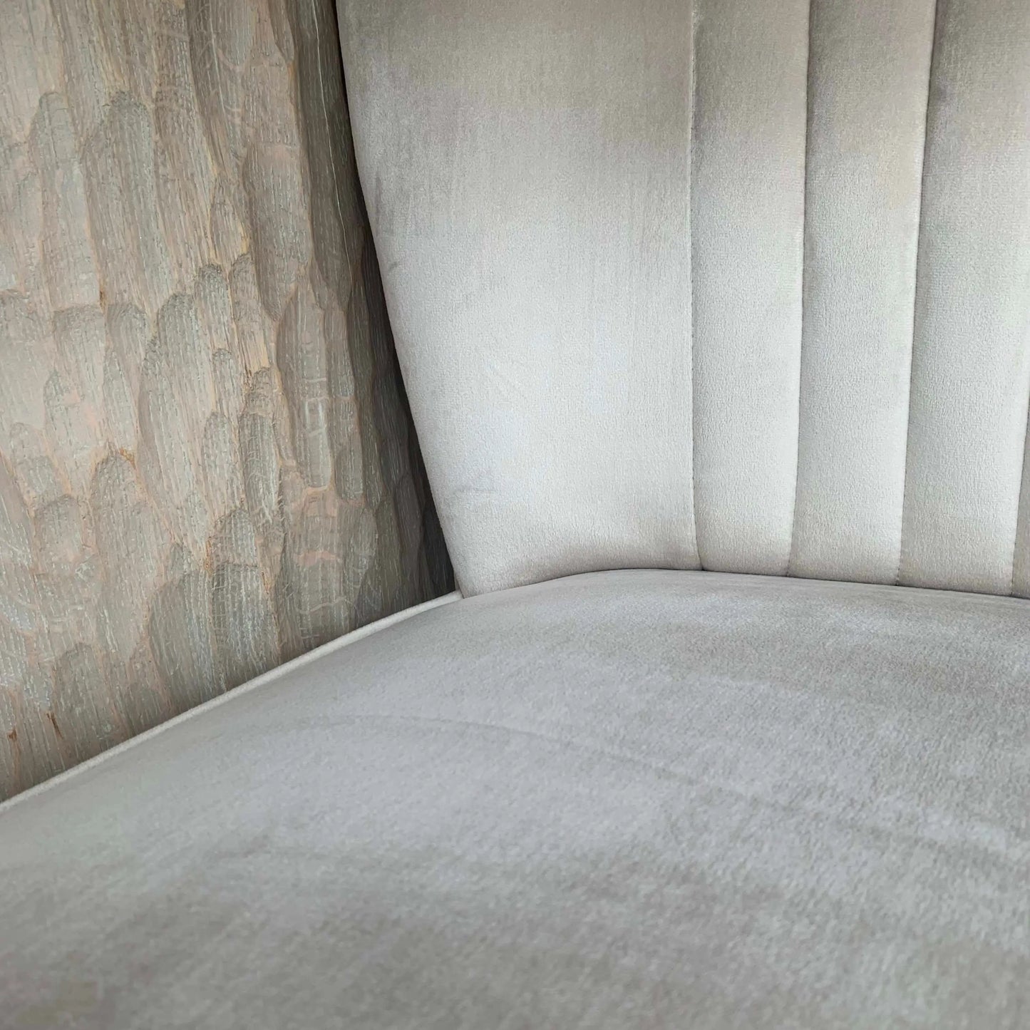 Sorrento plush cream velvet occasional chair with pleated detailing on backrest, matching cream piped edges and black wooden legs, at Albury House Interiors 