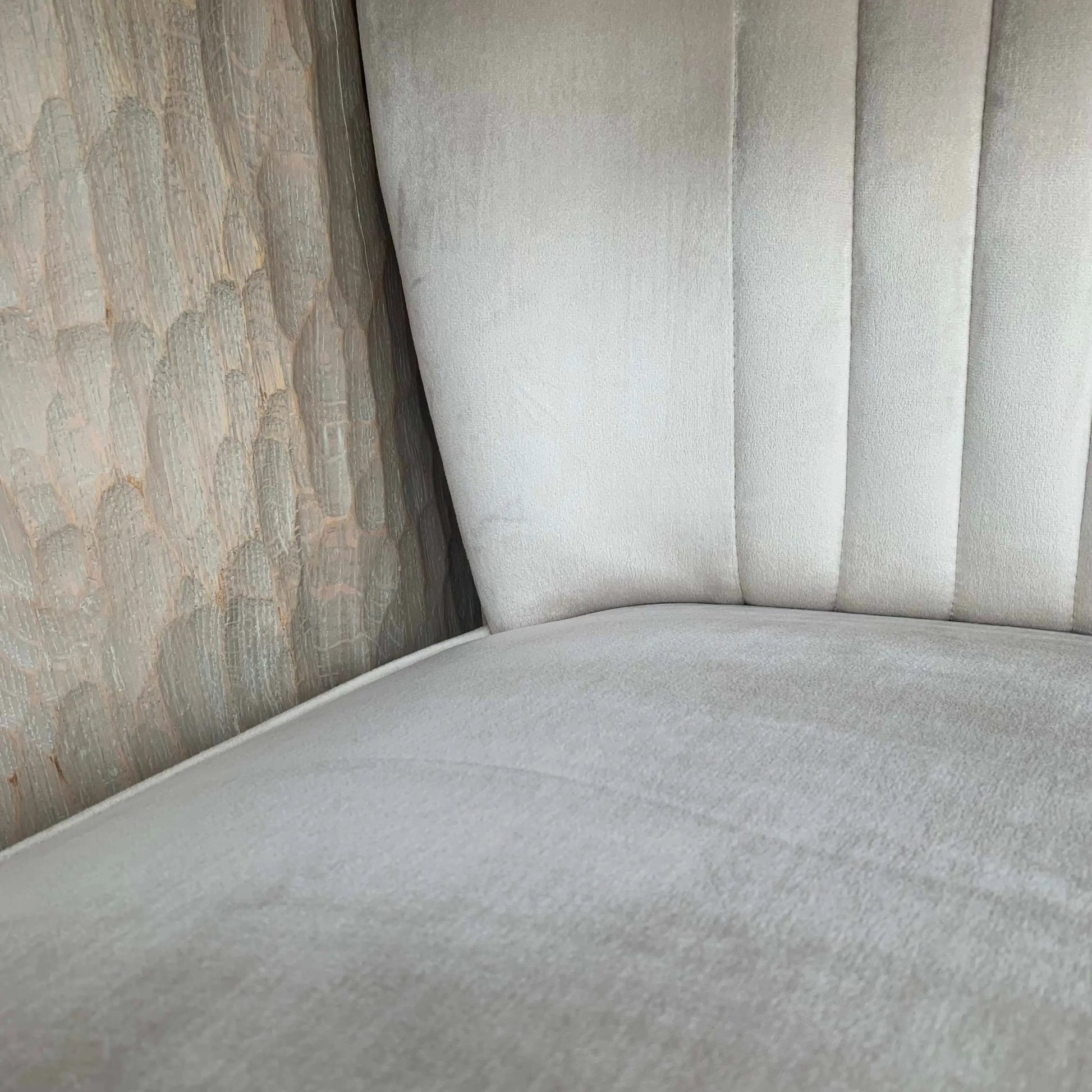 Sorrento plush cream velvet occasional chair with pleated detailing on backrest, matching cream piped edges and black wooden legs, at Albury House Interiors 