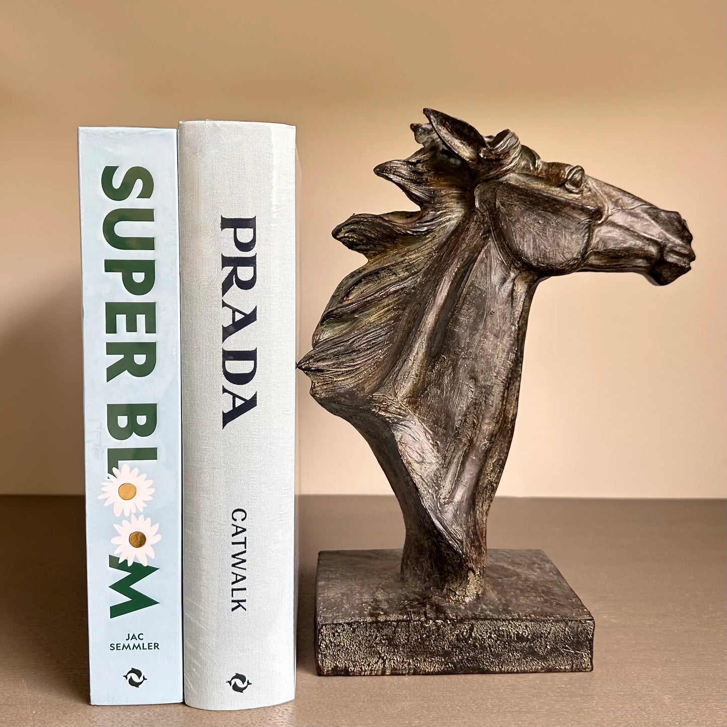 bronze-spirit-horses-head-sculpture-ornament-with -blue-superbloom-hardback-book-and-baby-blue-prada-catwalk-book-at-albury-house-interiors-essex