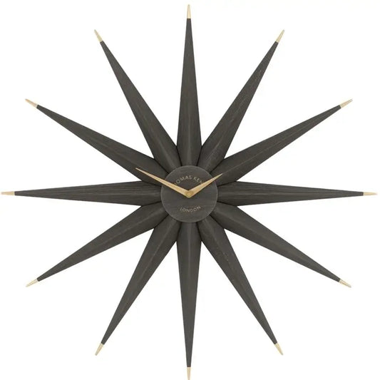 Starburst statement wall clock in North Star shape crafted from wood and finished in a dark warm grey, with gold accents and matching clock hands. Available to purchase from Albury House Interiors, home decor and accessories shop in Essex. 