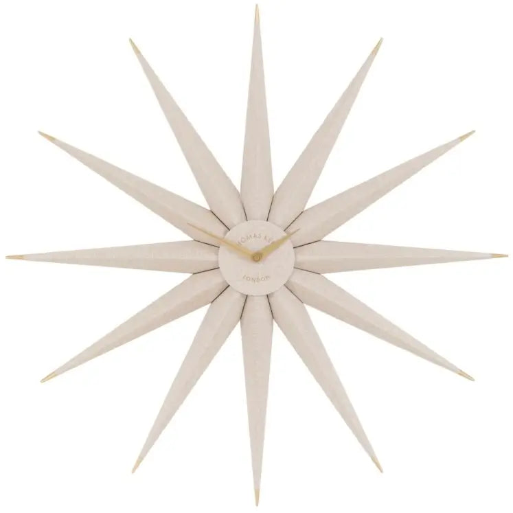 Starburst wooden statement wall clock crafted from wood shaped like the North Star. Accents of gold and matching gold clock hands, available to purchase at Albury House Interiors.