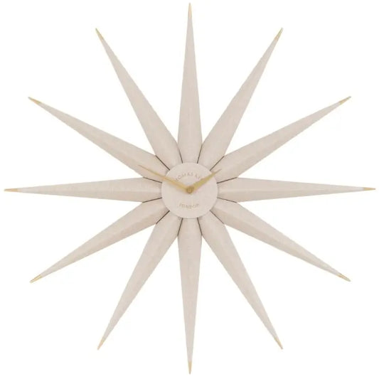 Starburst wooden statement wall clock crafted from wood shaped like the North Star. Accents of gold and matching gold clock hands, available to purchase at Albury House Interiors.