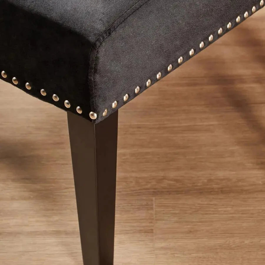 Cologne black soft velvet occasional chair with matching black wooden square legs and silver studded detail around front and back edges. Available at Albury House Interiors