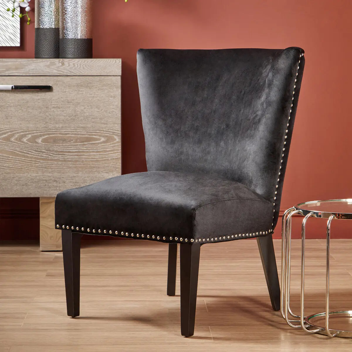 Cologne black soft velvet occasional chair with matching black wooden square legs and silver studded detail around front and back edges. Available at Albury House Interiors