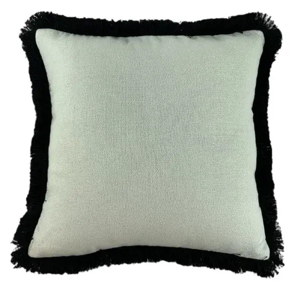 Sully square white cushion with soft texture and black thick fringed tassel edge. Complete with feather filled insert, and machine washable. Available to purchase at Albury House Interiors, Matching Tye Essex. 