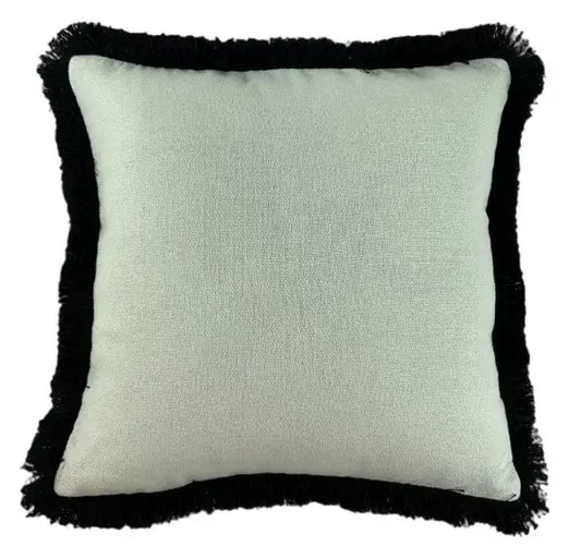Sully square white cushion with soft texture and black thick fringed tassel edge. Complete with feather filled insert, and machine washable. Available to purchase at Albury House Interiors, Matching Tye Essex. 