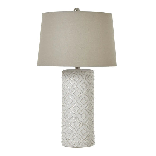 tall-white-ceramic-dimple-lamp-with-diamond-pattern-and-neutral-linen-lamp-shade-at-albury-house-interiors-essex