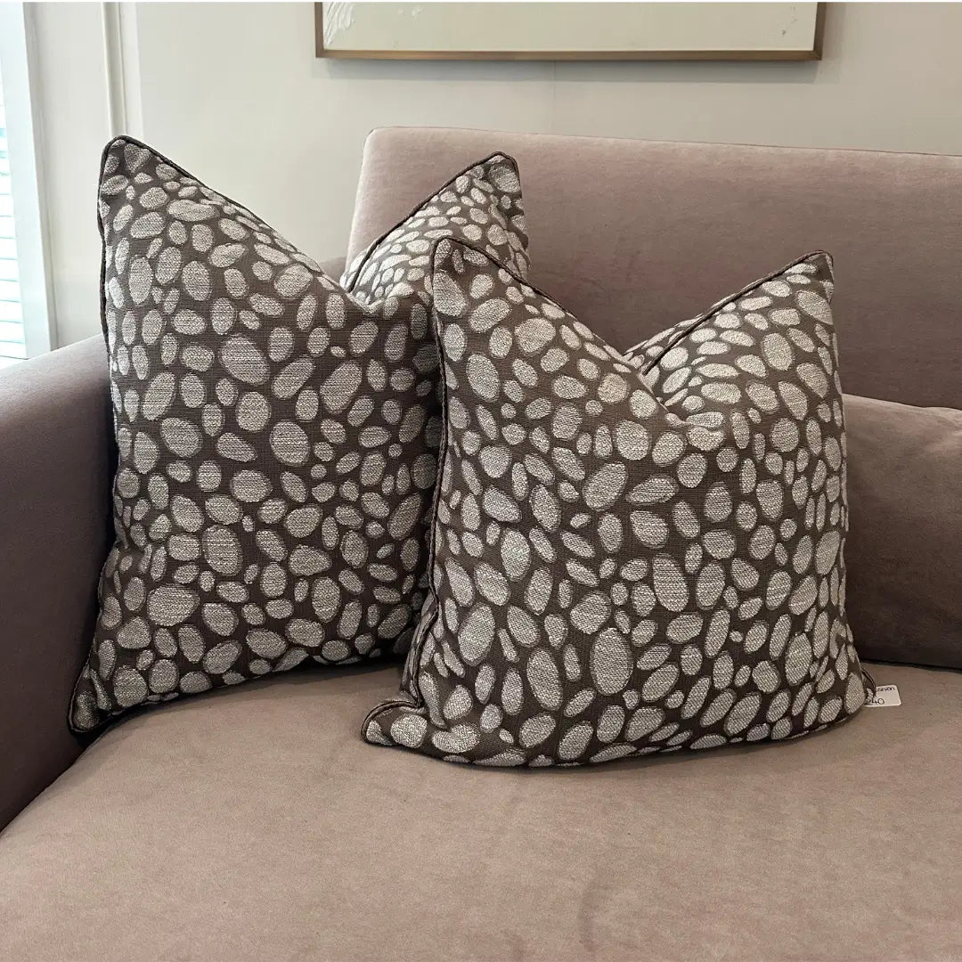 taupe-and-grey-square-piped-pebbles-patterned-cushions-on-beige-brandon-sofa-at-albury-house-interiors-essex
