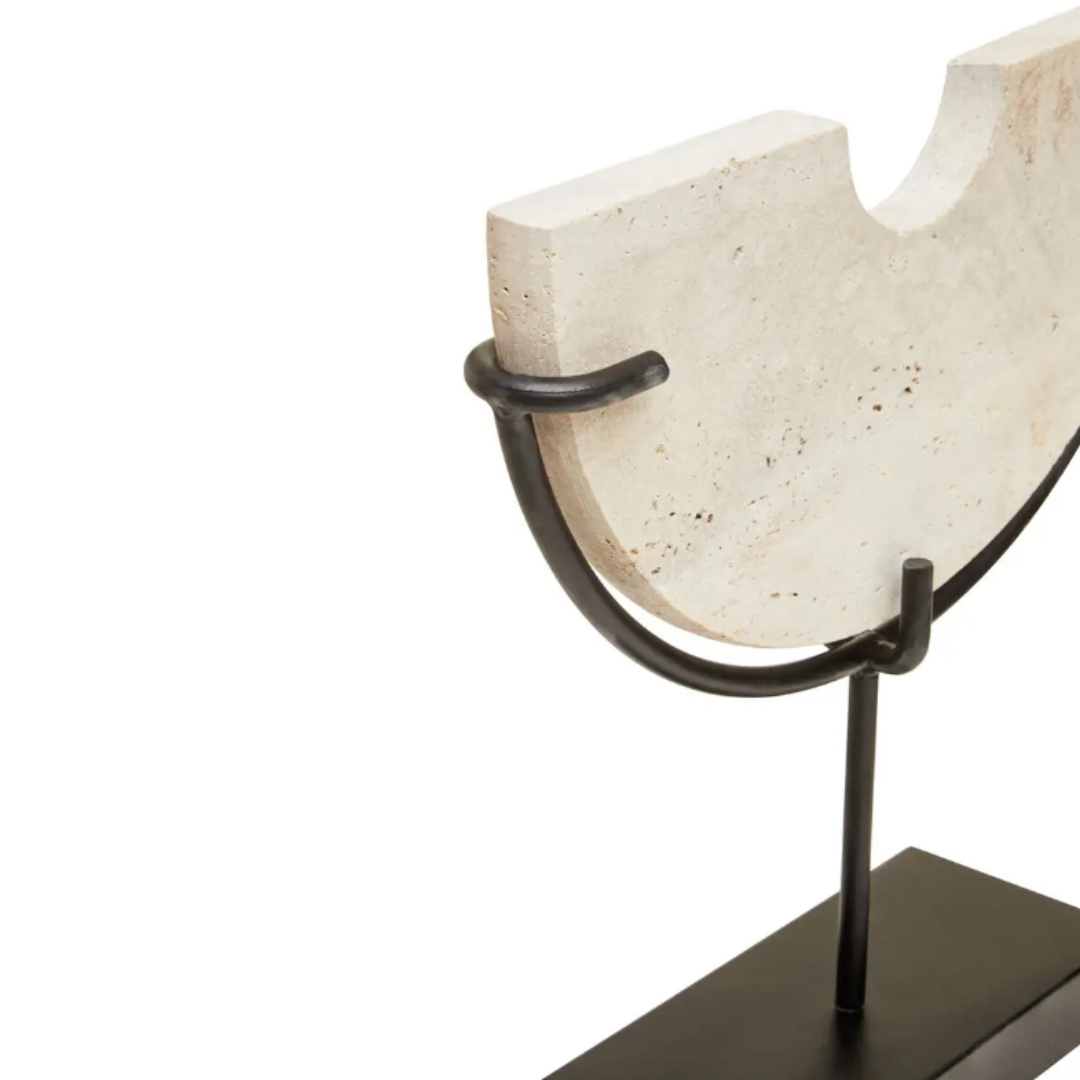 Natural travertine stone crafted into a half moon semi-circle shape, displayed on a matte black stand. Used by interior designers and home stylists. Available to purchase at Albury House Interiors. 
