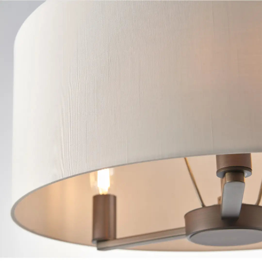 Trevi antique brushed bronze finish ceiling light, with 3 arms and bulbs. Complete with faux silk shade. Whole collection available to purchase at Albury House Interiors.
