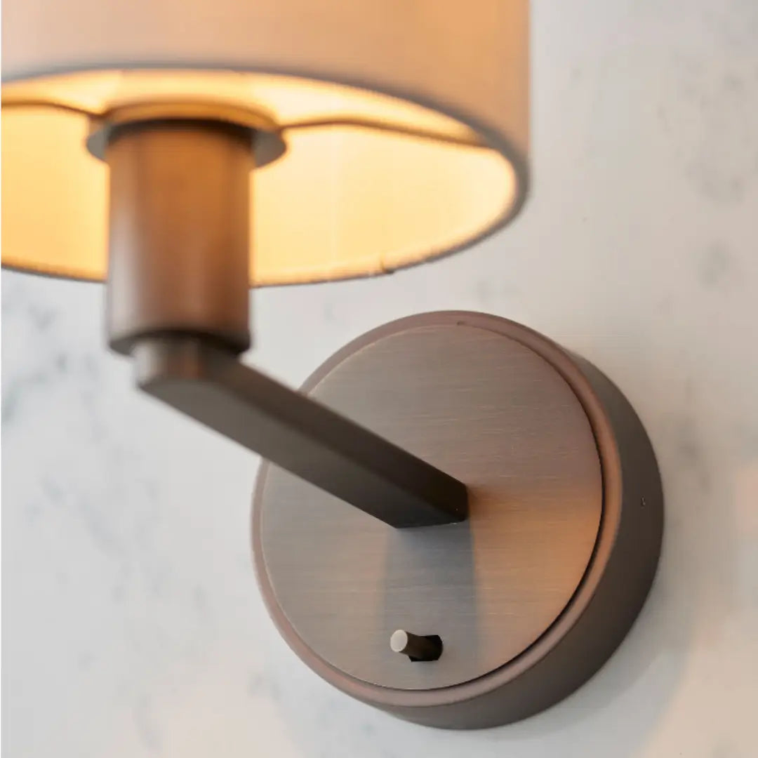 Trevi antique brushed bronze wall light sconce, with white marble faux silk shade and on/off switch. Available to purchase from Albury House Interiors, with matching ceiling lights available.