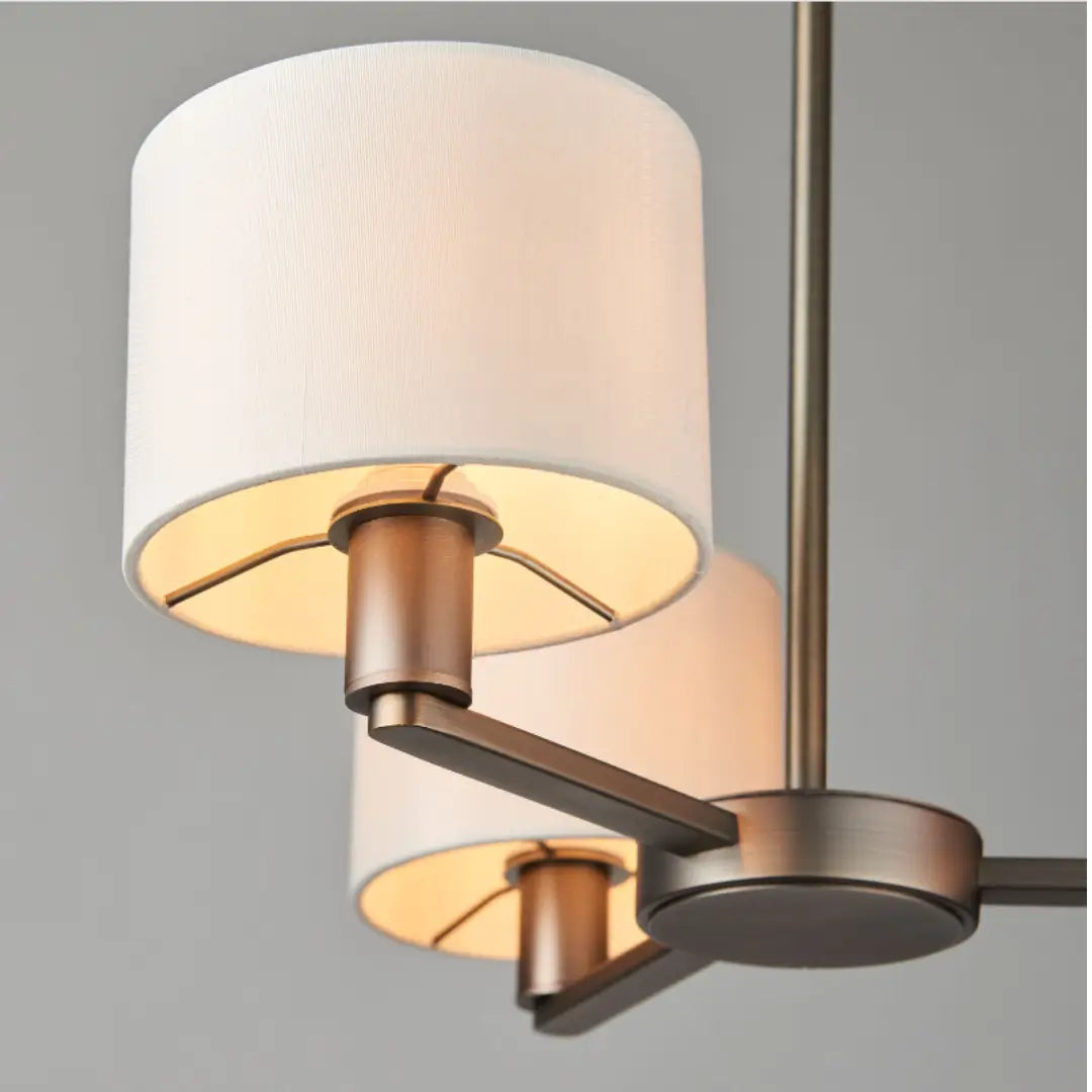 Trevi ceiling pendant with 3 arms finished in antique dark brushed bronze, and 3 faux silk shades. Whole collection available to purchase at Albury House Interiors.