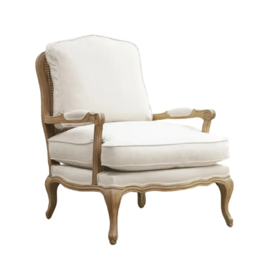 Valais arm chair crafted rom solid oak with rattan back. Cream linen upholstered seat and backrest cushion, with matching armrest padding. Available to purchase from Albury House Interiors in two colours.