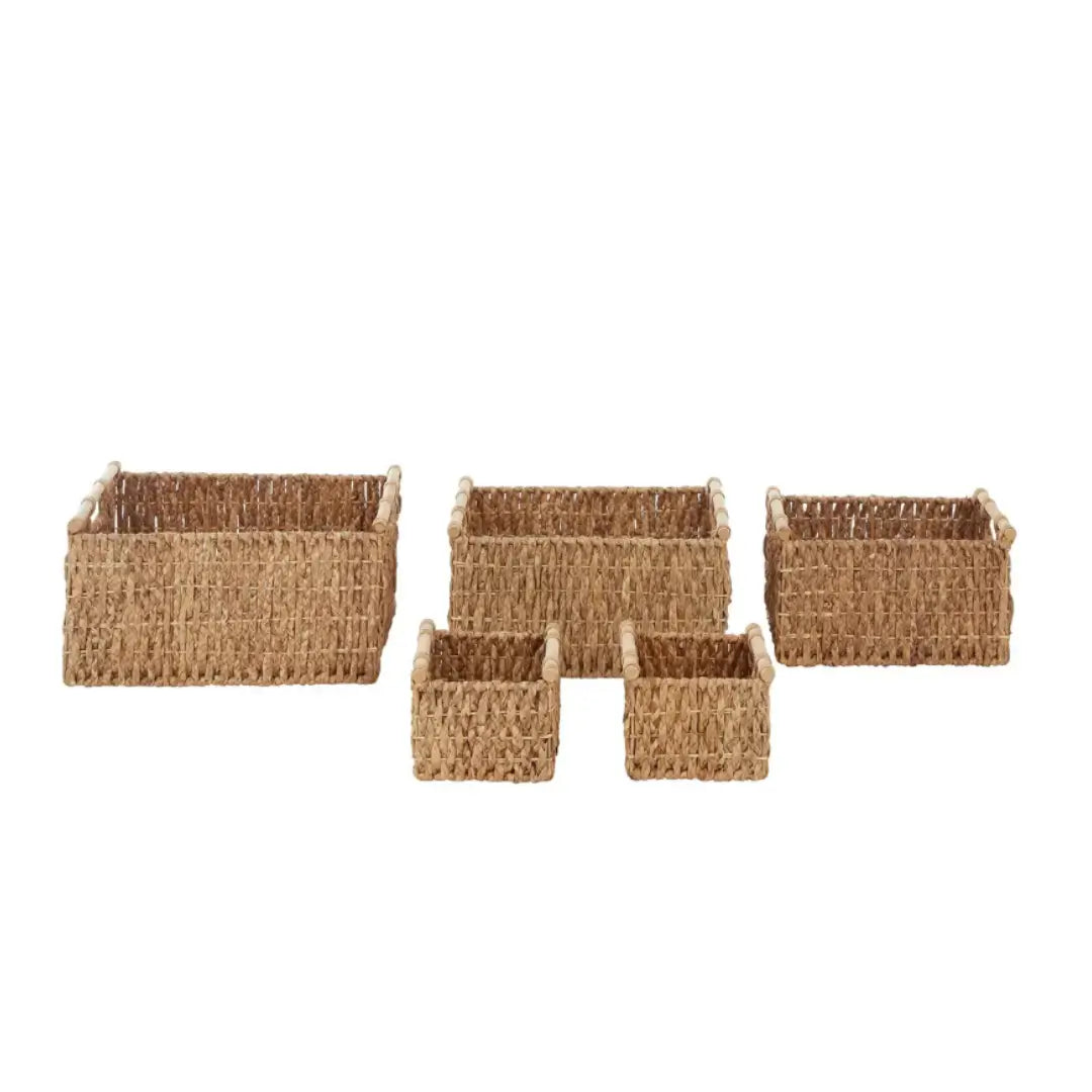 Set of 5 storage baskets crafted from natural water hyacinth, with wooden handles to match the colour scheme, in varying sizes. Available to purchase from Albury House Interiors, Essex. 