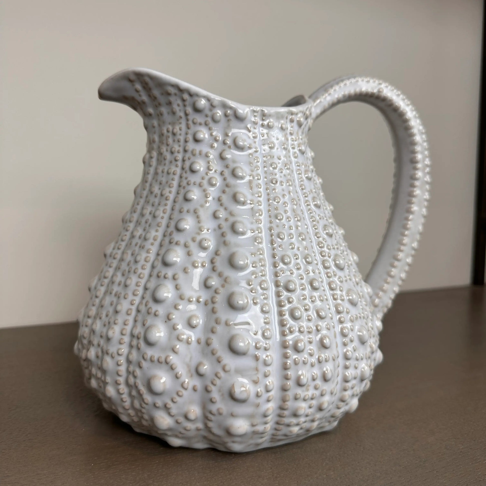 white-ceramic-dimple-texture-urchin-jug-vase-with-handle-at-albury-house-interiors