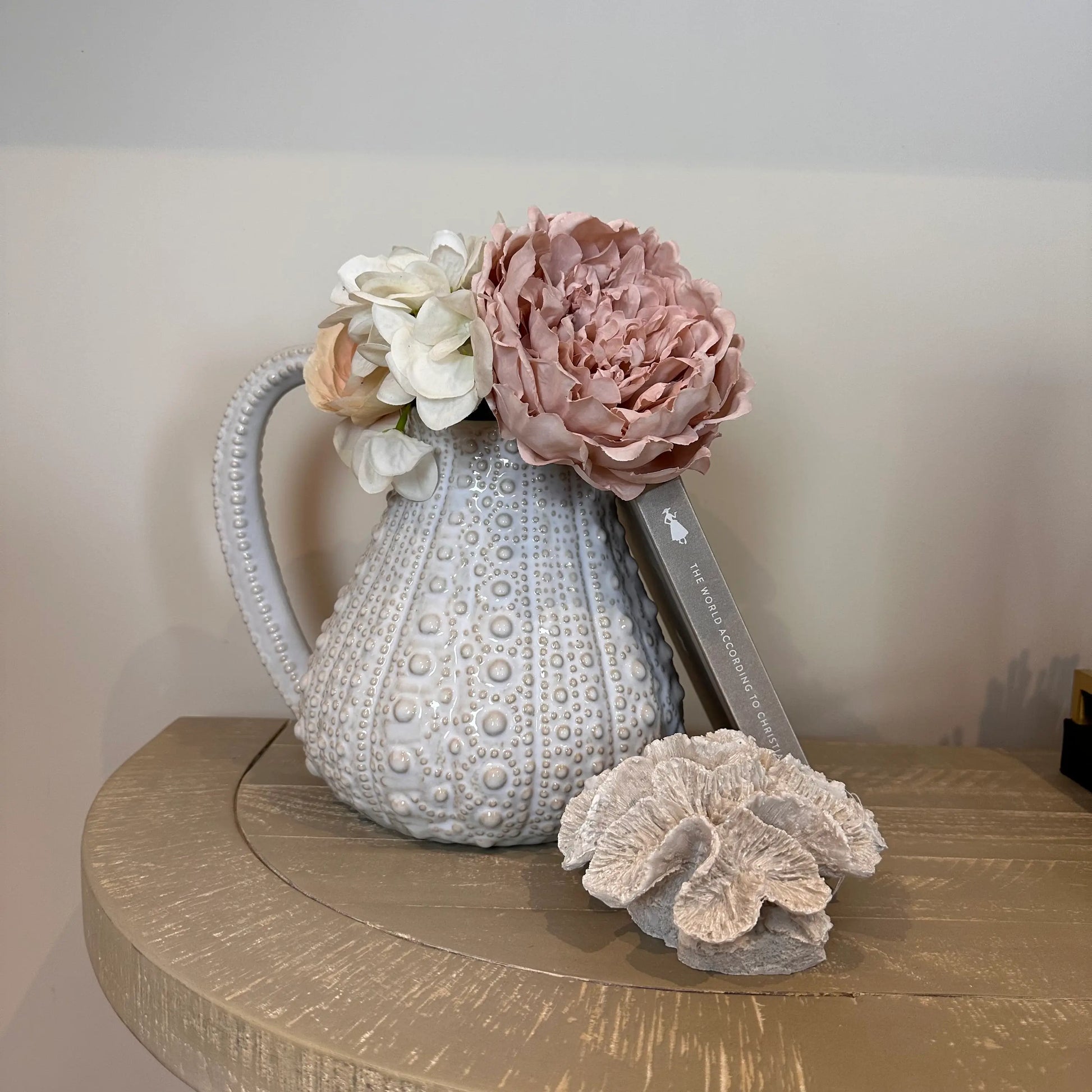white-ceramic-dimple-texture-urchin-jug-vase-with-faux-flowers-and-faux-coral-with-handle-at-albury-house-interiors