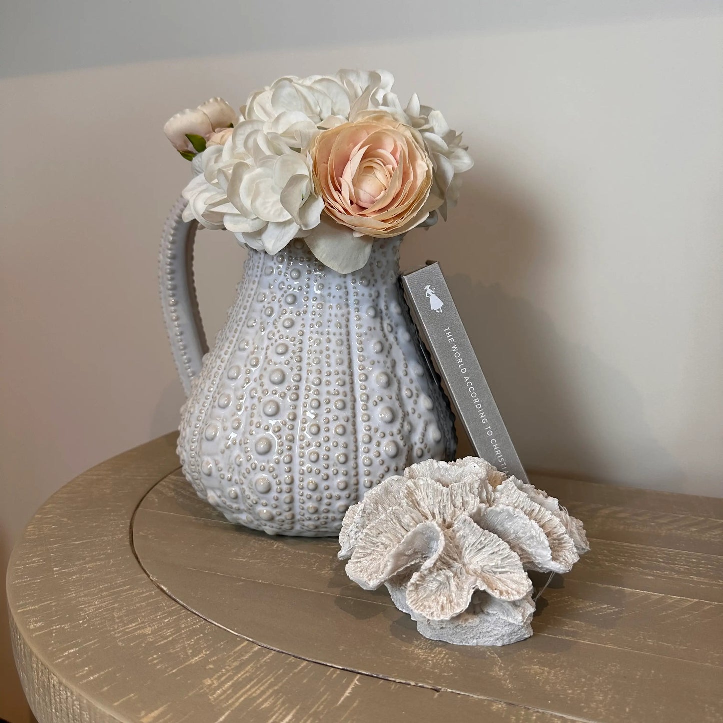 white-ceramic-dimple-texture-urchin-jug-vase-with-faux-flowers-and-faux-coral-with-handle-at-albury-house-interiors