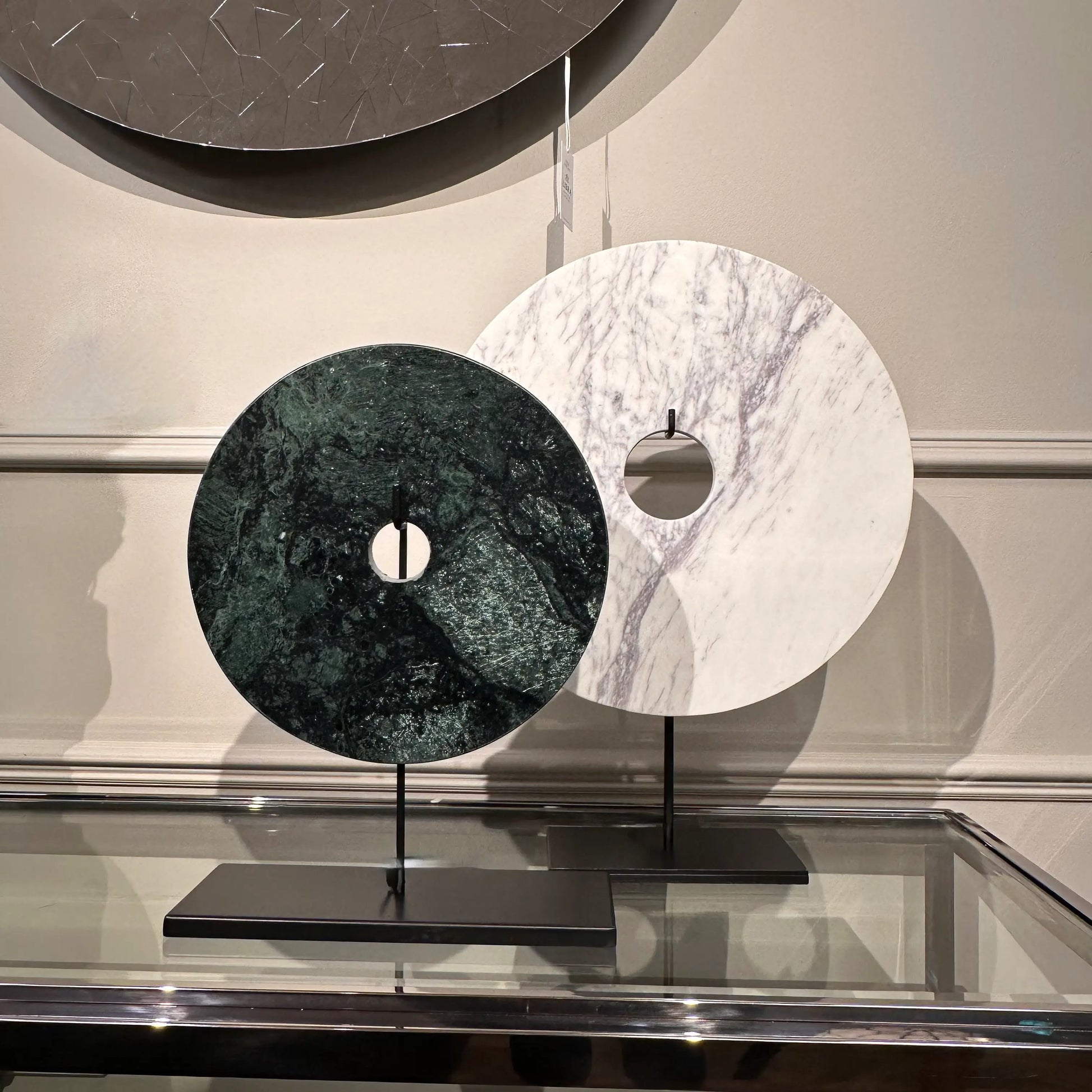 white-and-green-marble-discs-on-matt-black-stands-at-albury-house-interiors